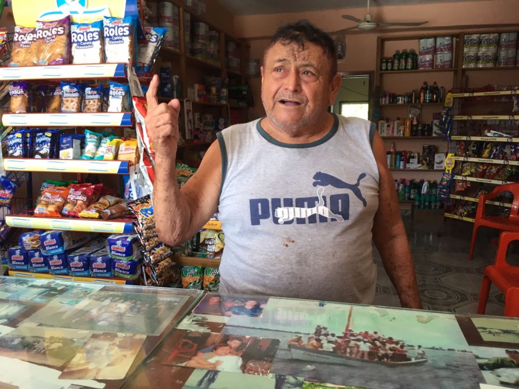 Photo of Melchor Villaneuva behind the counter of his general store in Xcalak. Photo copyright: Gabriela Lendo
