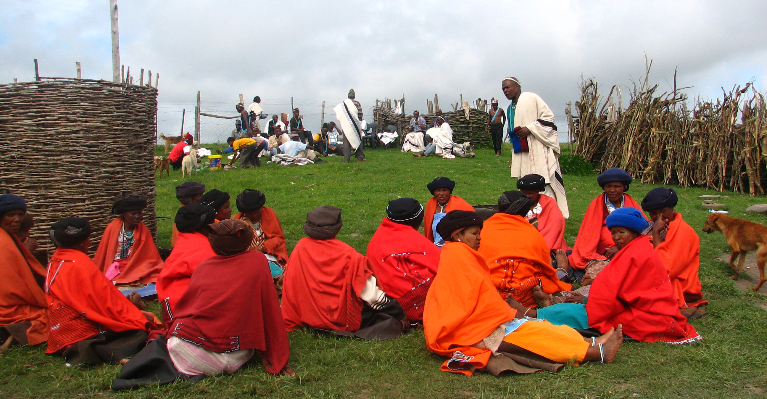 A group of Xhosa women, many of whom have returned from urban employment, wear traditional dress and await a cultural ceremony at the homestead’s focal point: the kraal. Photo: V. Masterson