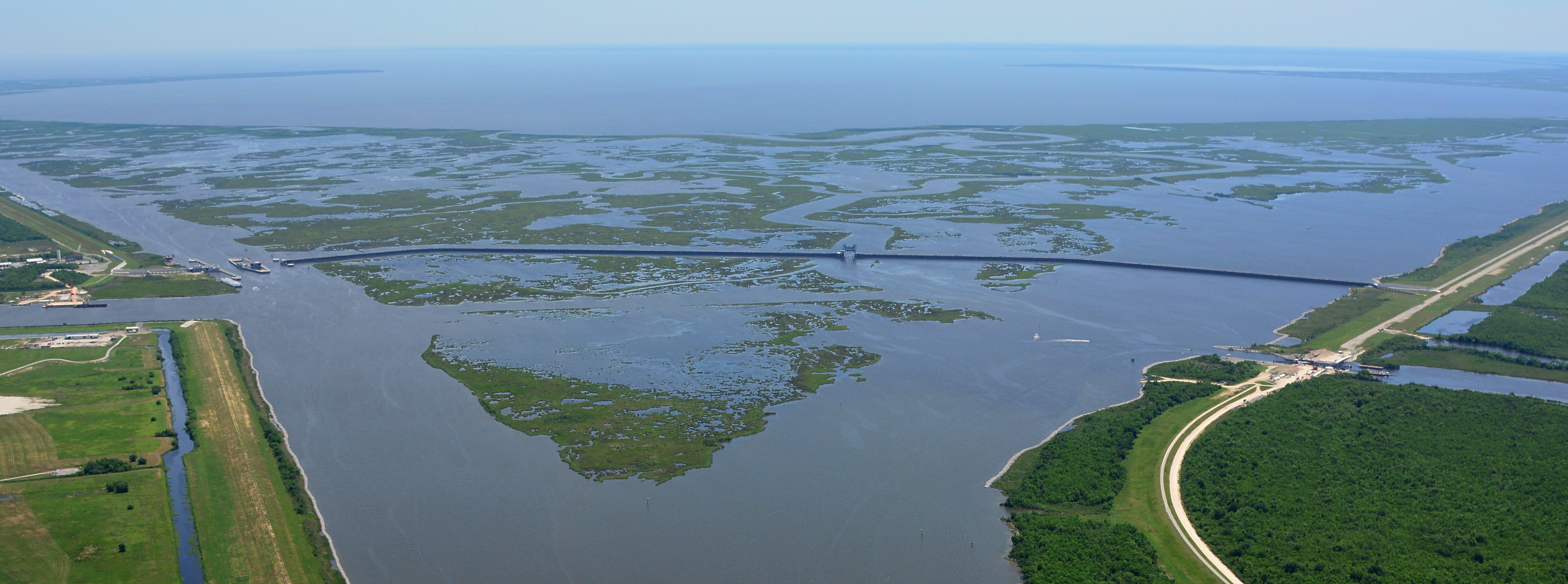 A storm surge barrier in Louisiana, which closed the Gulf Outlet shipping canal in 2010. Gulf of Mexico in the distance. Photo credit: US Army Corps of Engineers.