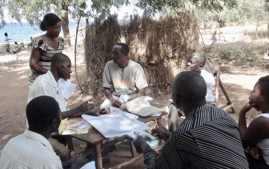 Villagers, researchers, and local officials discuss resource competition on the shores of Lake Kariba, Zambia. Photo: Ryder Haske